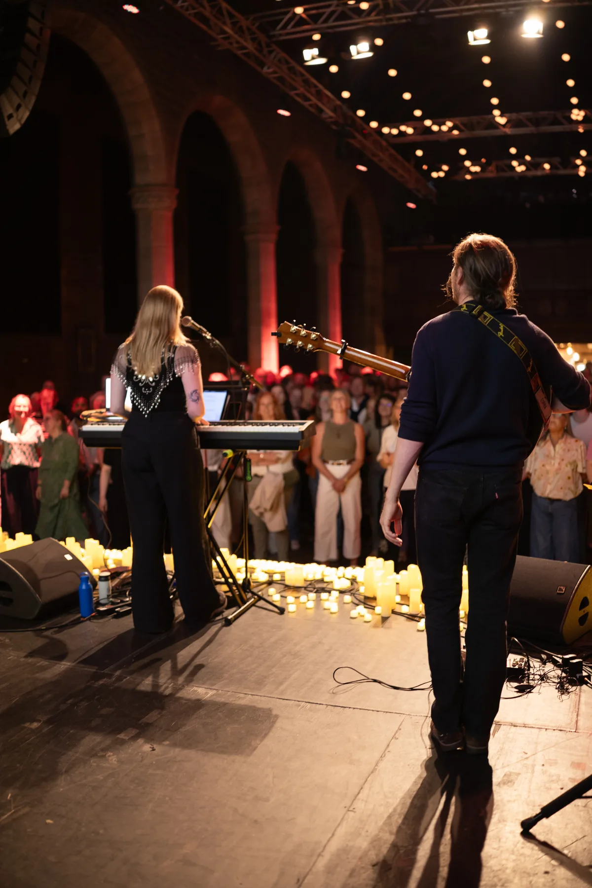 Choir Party by candlelight — a conductor leading a candlelit crowd